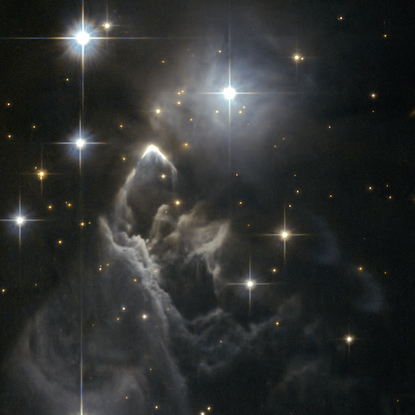 The little-known nebula IRAS 05437+2502 billows out among the bright stars and dark dust clouds that surround it in this striking image from the Hubble Space Telescope. It is located in the constellation of Taurus (the Bull), close to the central plane of our Milky Way galaxy.
